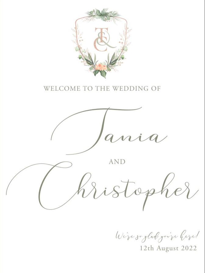 custom wedding welcome sign with a rose crest monogram element